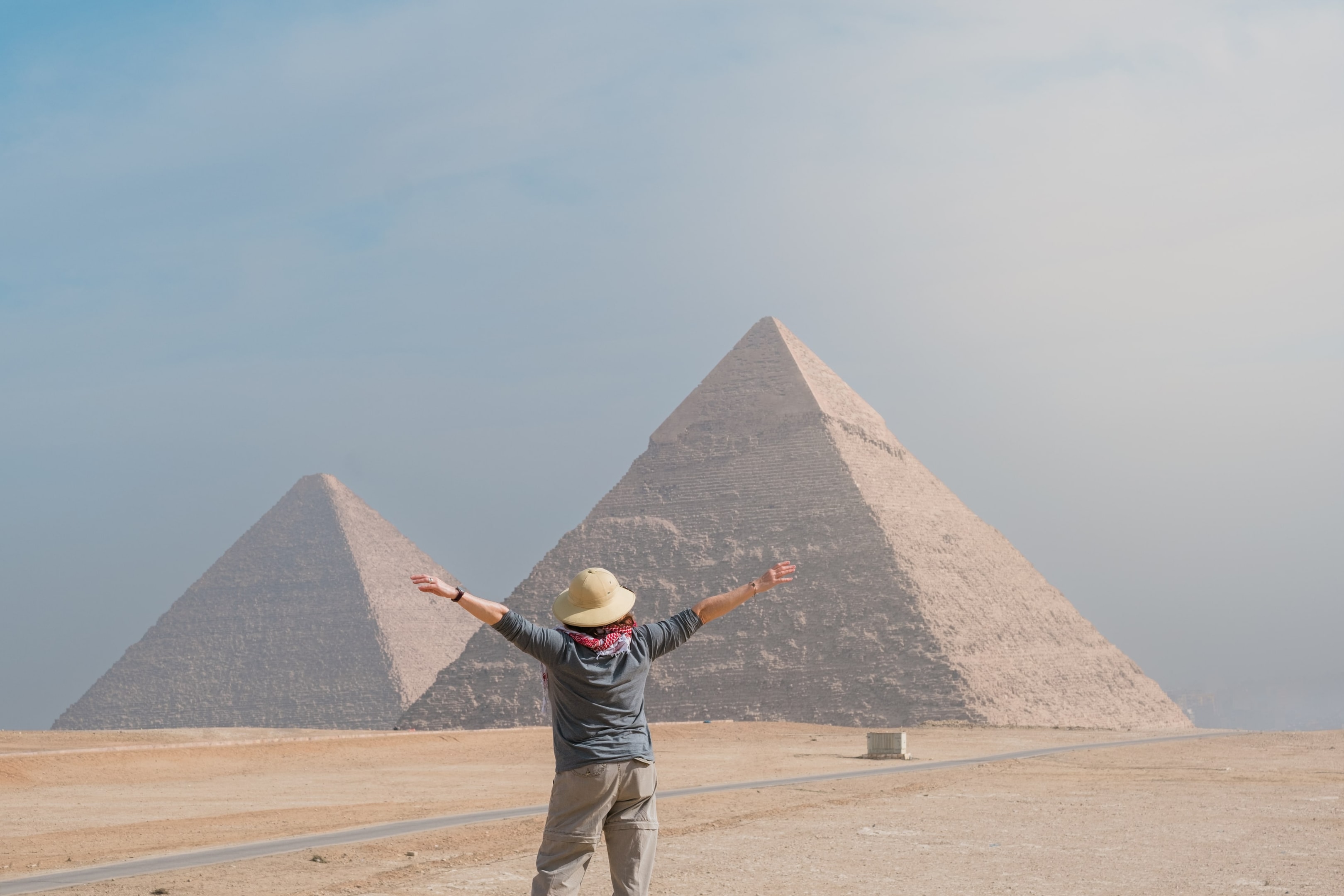 The Great Sphinx of Giza with the pyramids in the background.