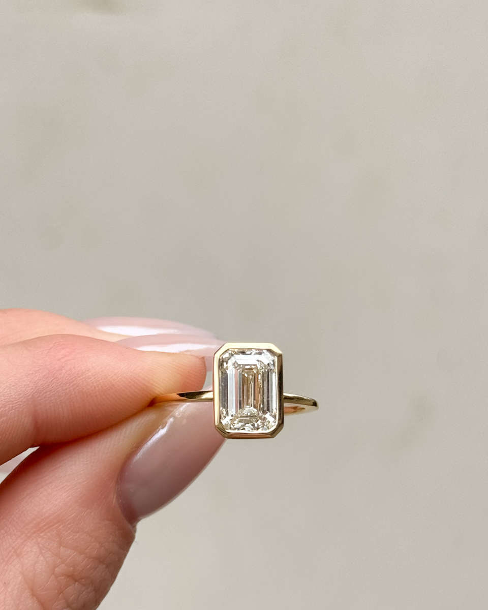Bezel Set Diamond engagement ring emerald cut