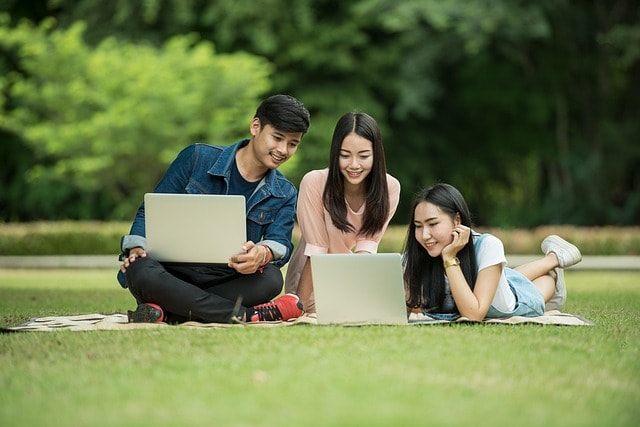 students, computers, laptops, smiling, park, study, studying, group work