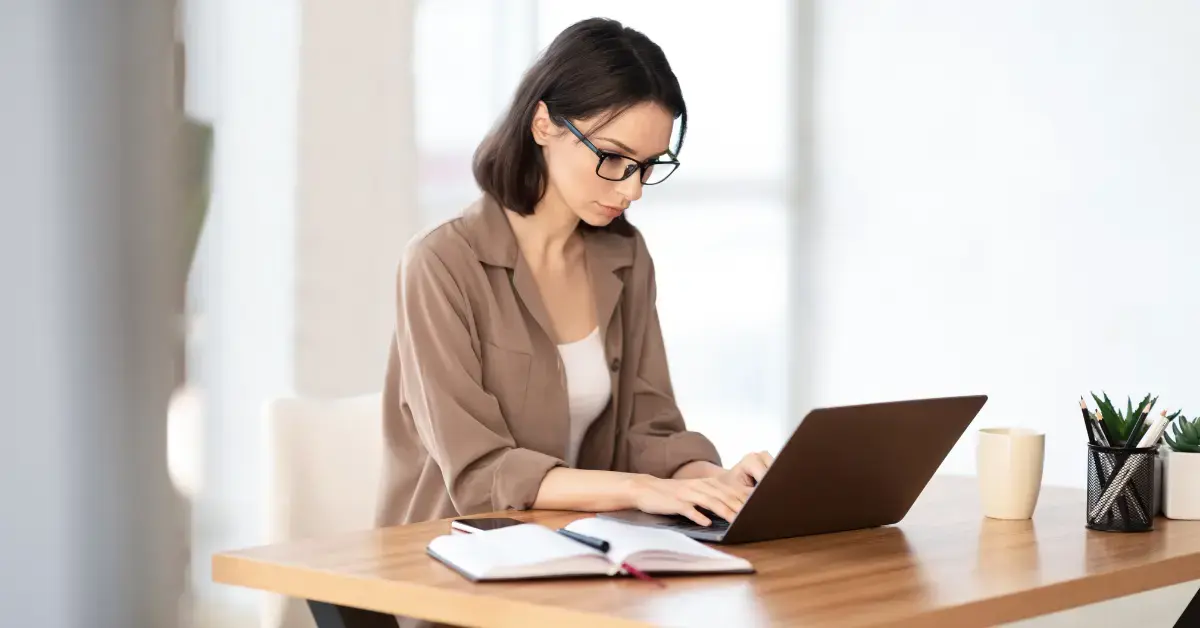 Woman reviewing an IRS notice related to the IRS automated collection system and unpaid tax debt.