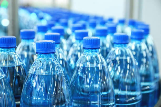 Rows of blue-capped bottled water, a common alternative in the distilled vs bottled water for CPAP machine.