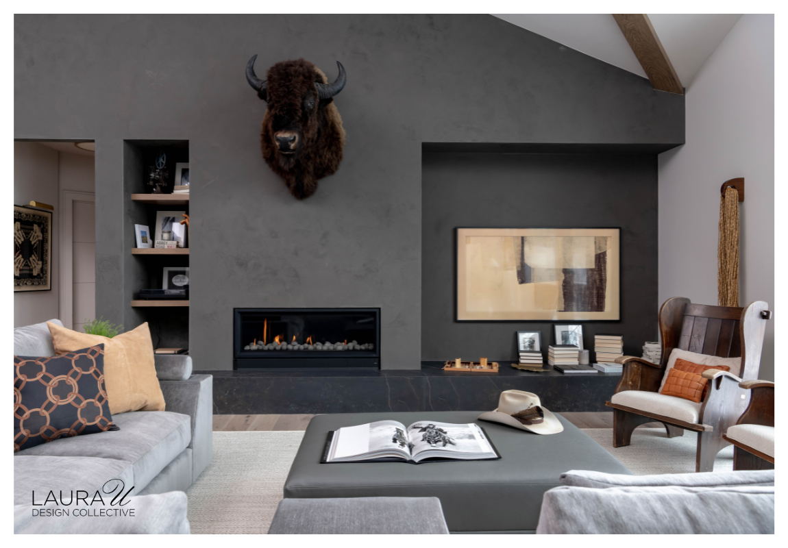 Modern fireplace wall with built-in white oak shelving, integrated bench seating, and dark plaster surround.