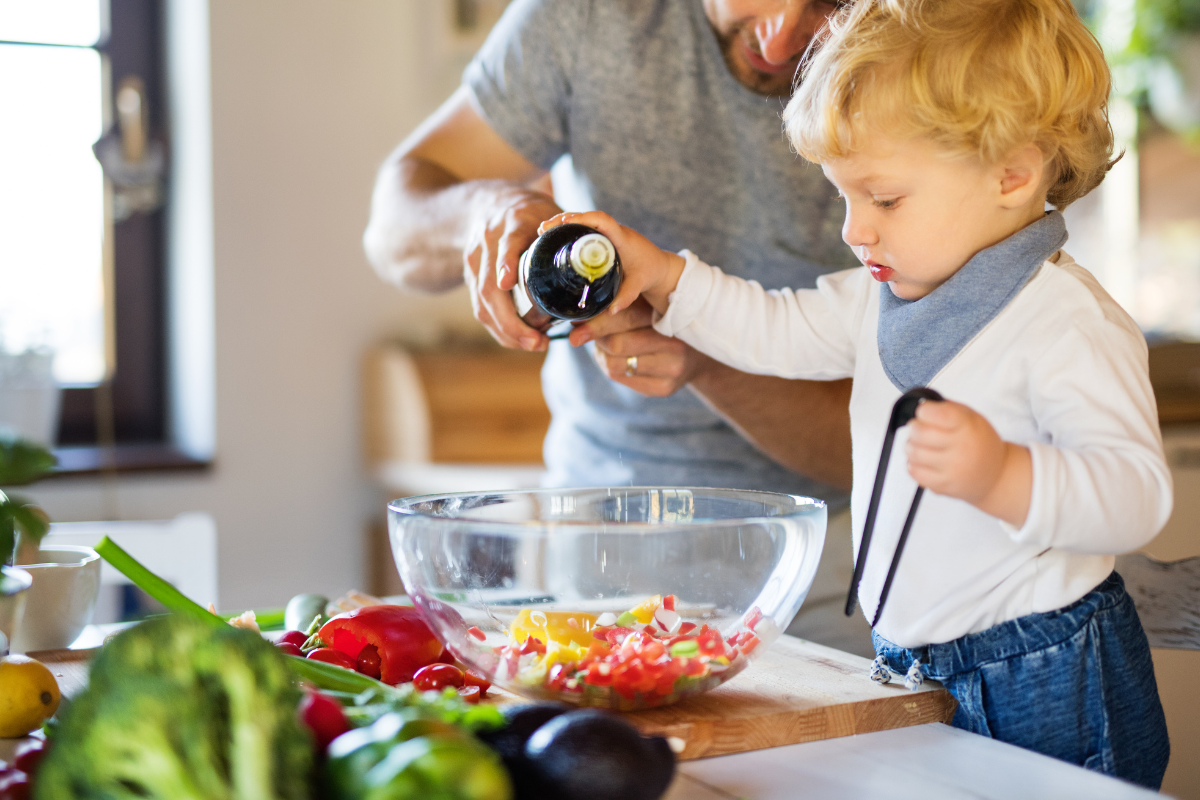 little boy helping cook balanced dinner meal