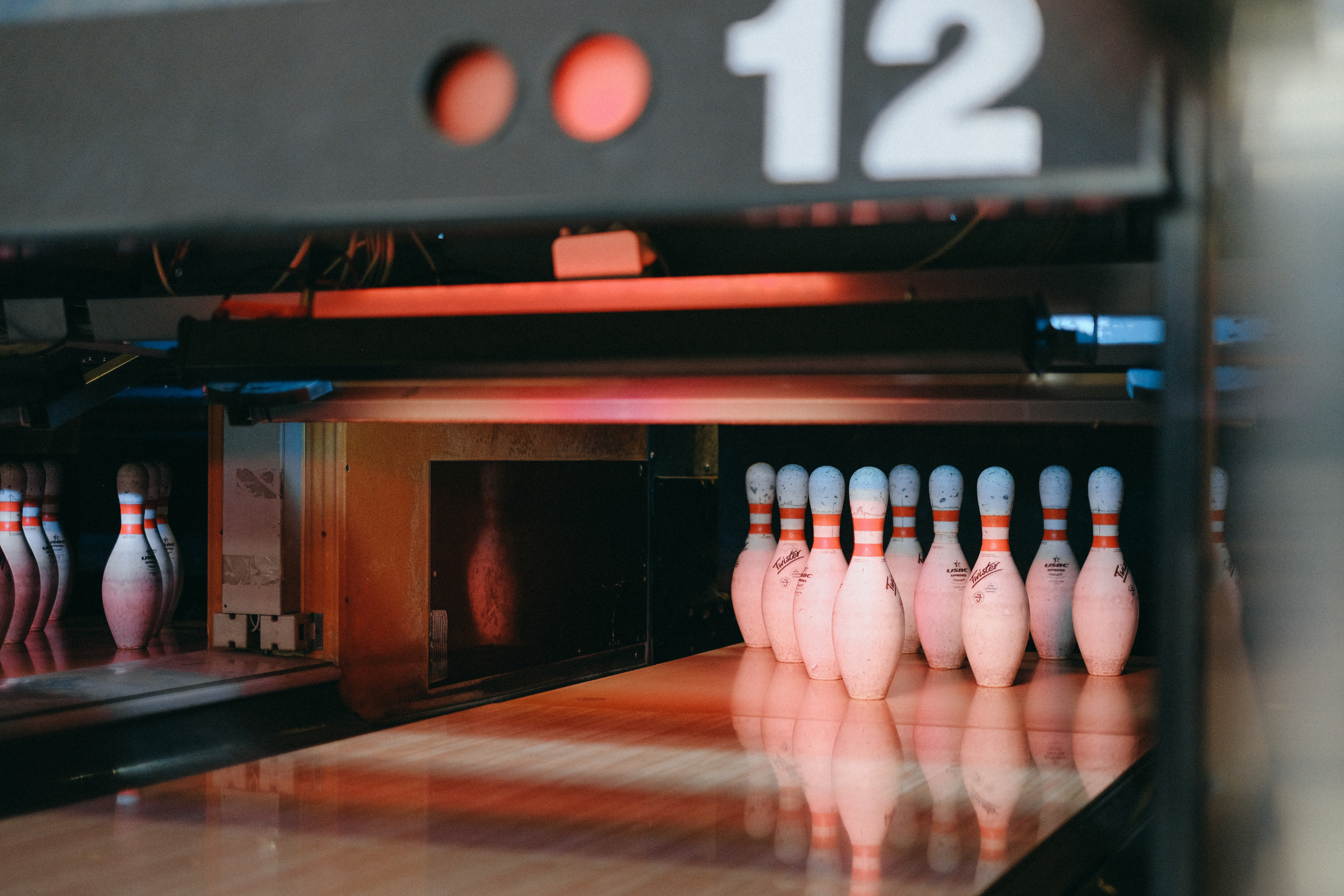 Bowling pins underneath a red light