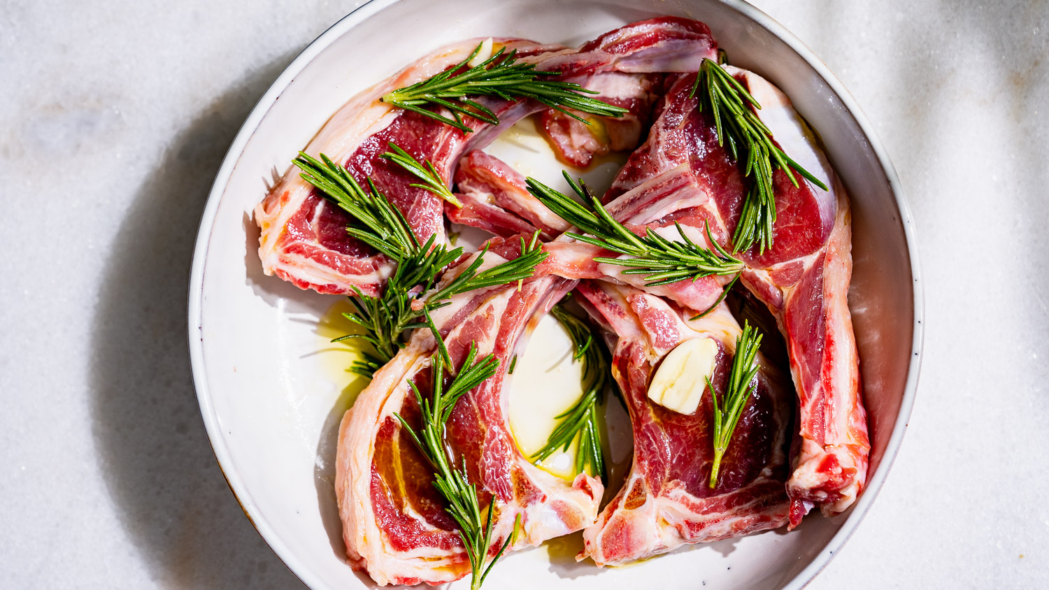 Marinated lamb chops with olive oil, garlic, rosemary and salt.