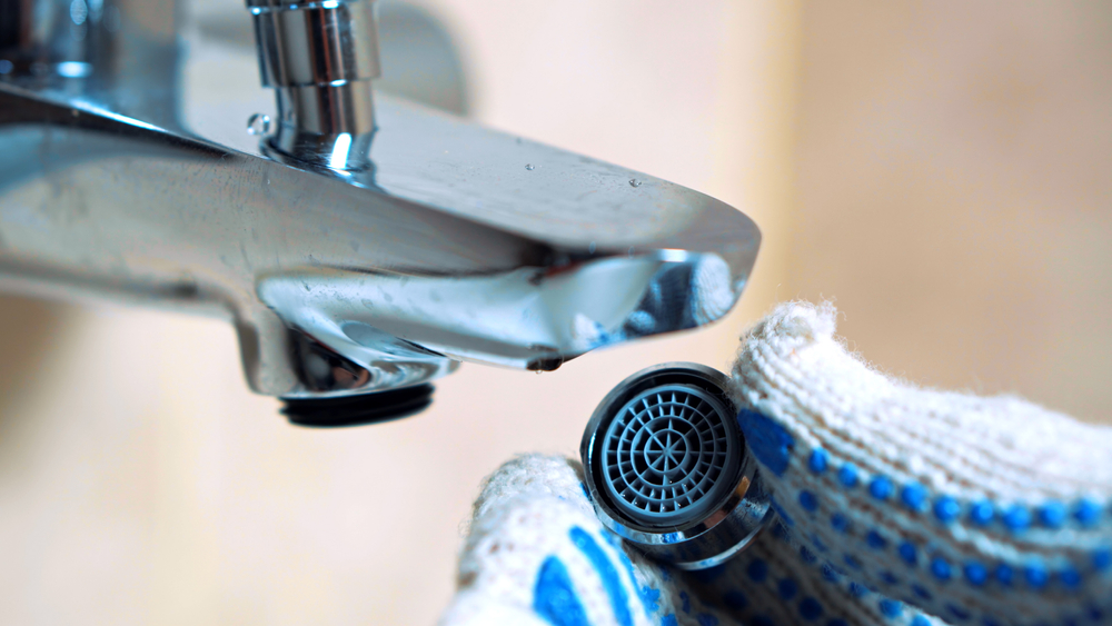 Close up of a faucet aerator