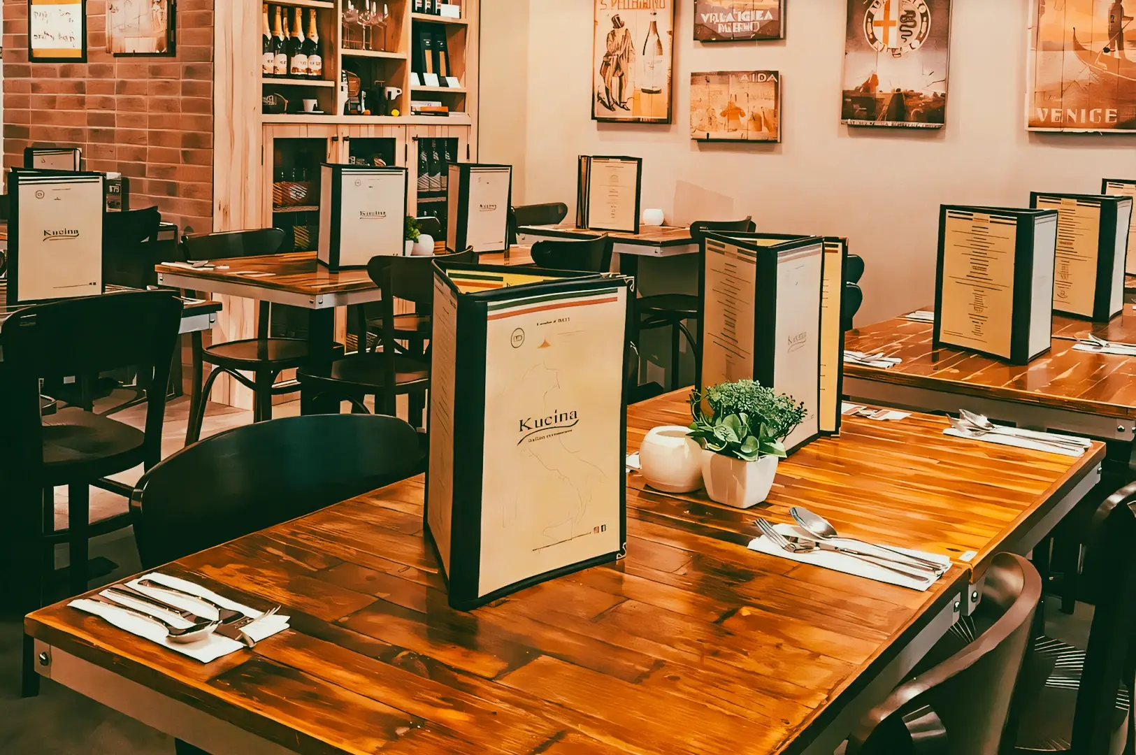 Eye-level shot of a cozy Italian restaurant interior with wooden tables, upright menu displays, wine shelves, and warm ambient lighting in a casual dining setting.