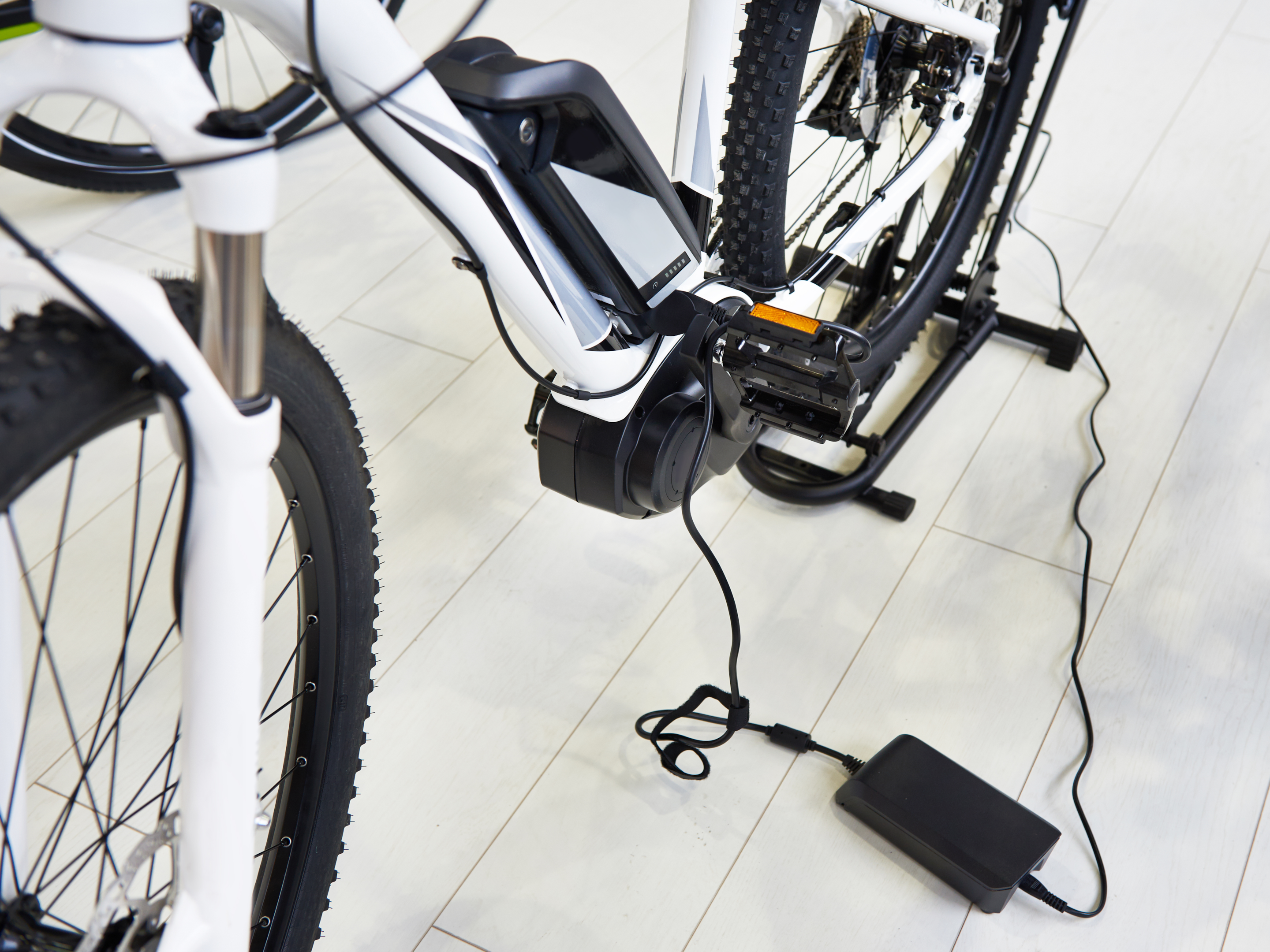 Electric bike with battery charger plugged in
