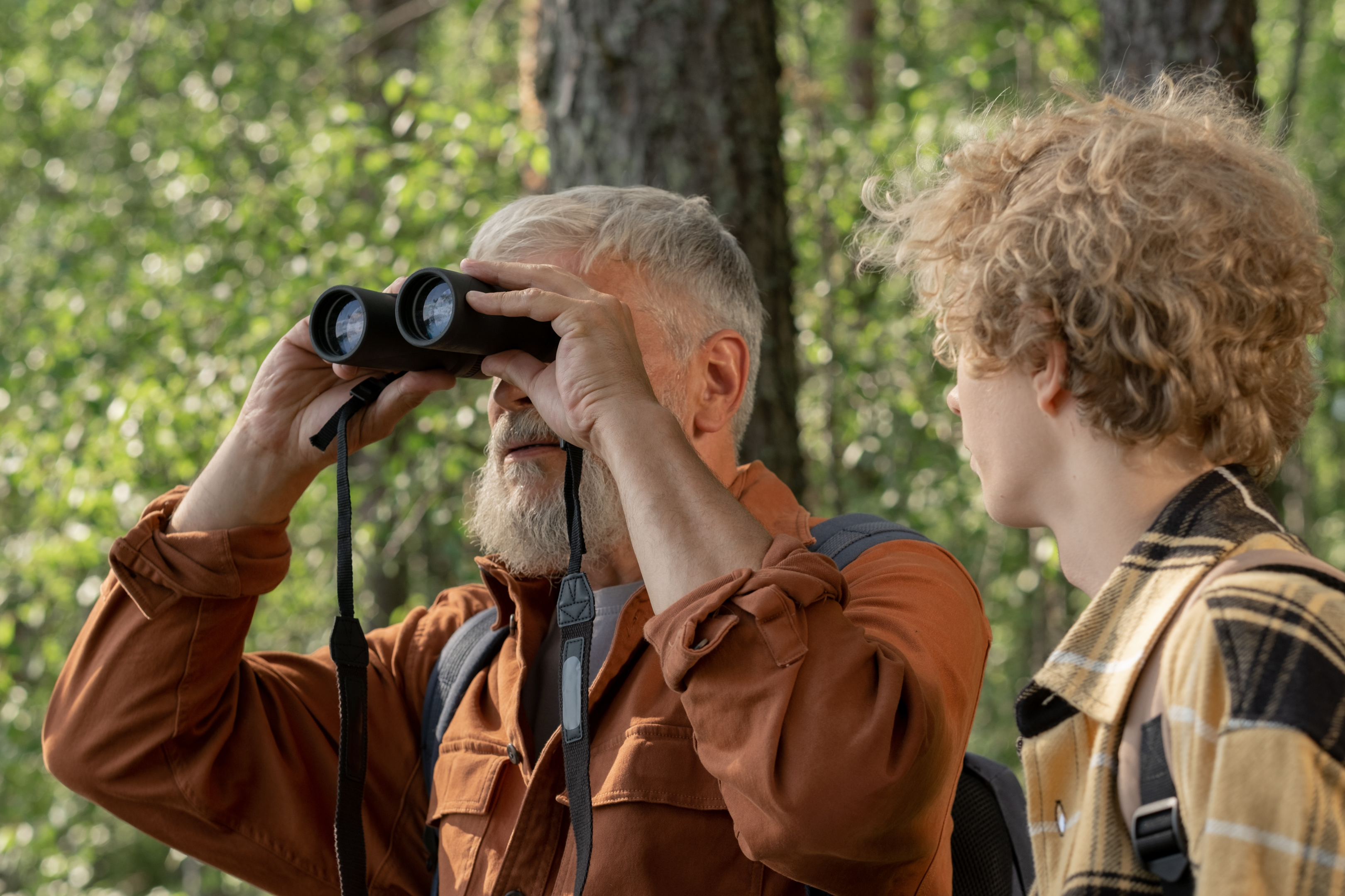 man, young man, binoculars