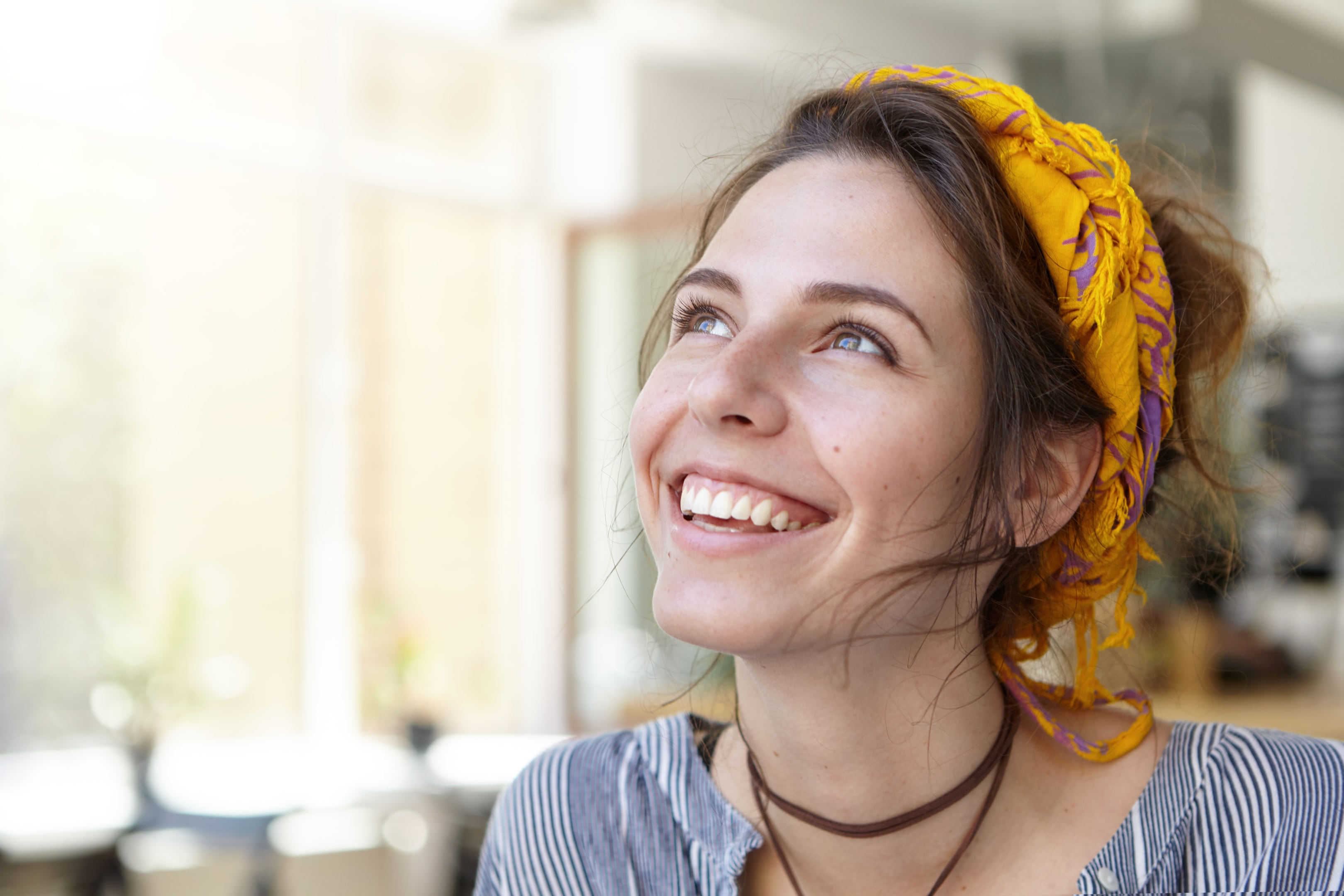 A young woman after her dental implant surgery.