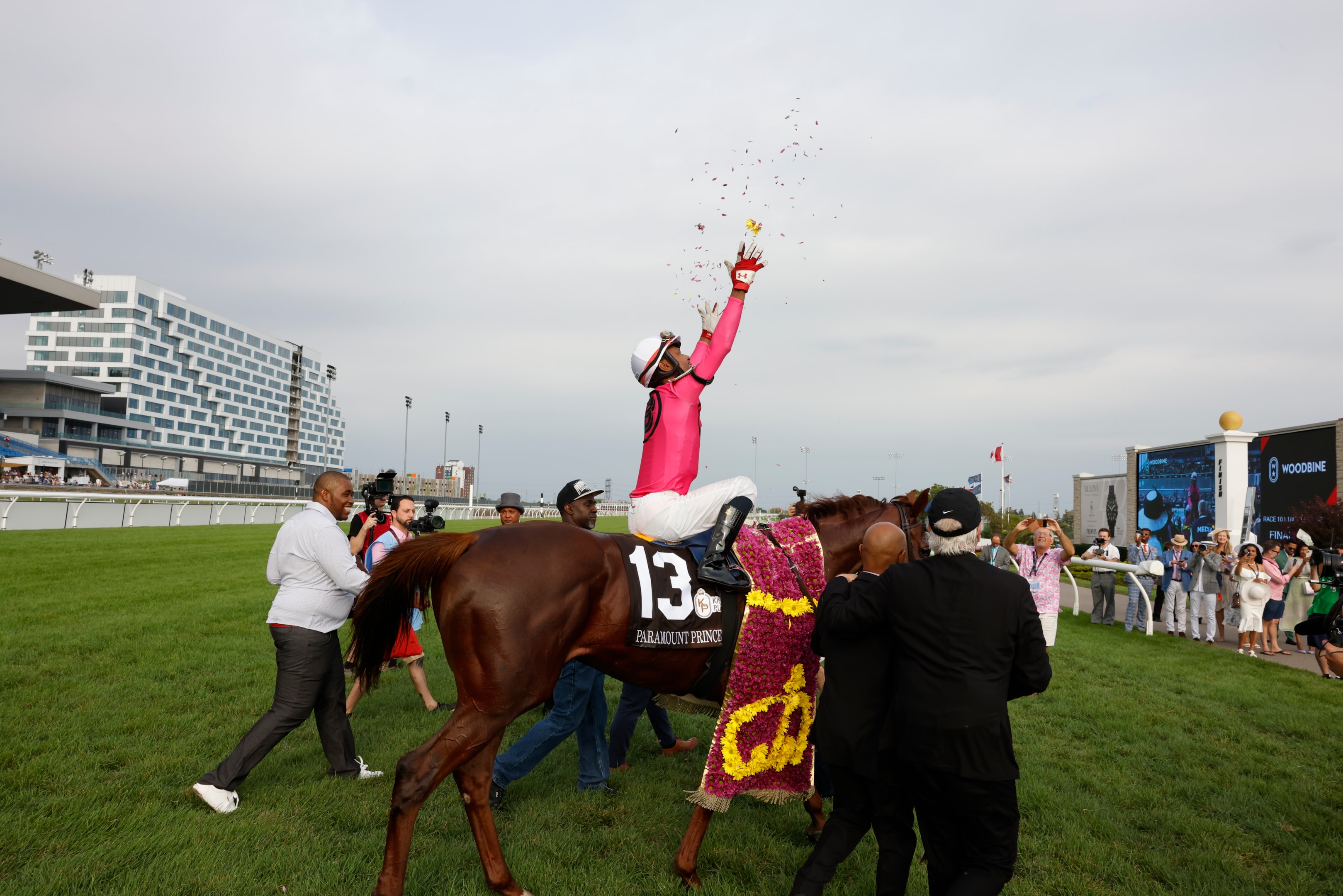 Jockey Patrick Husbands, atop Paramount Prince, celebrates after winning the King's Plate race at Woodbine Racetrack in Toronto. 