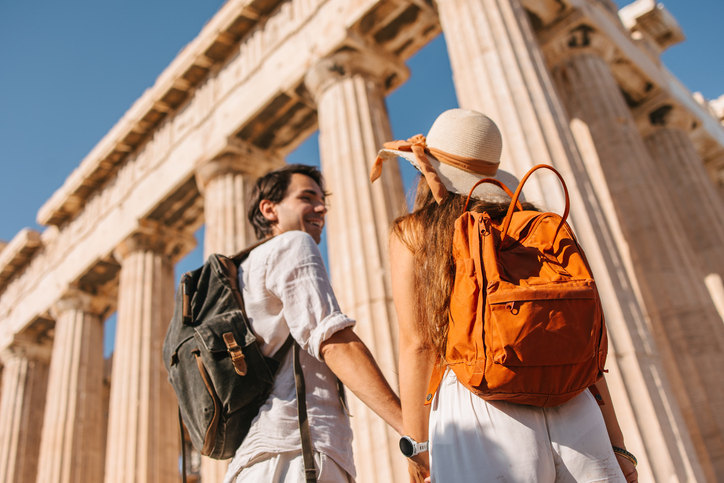 Happy couple in front of the Parthenon temple.