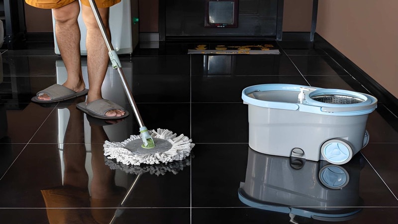 mopping of the floor with bucket and wringer