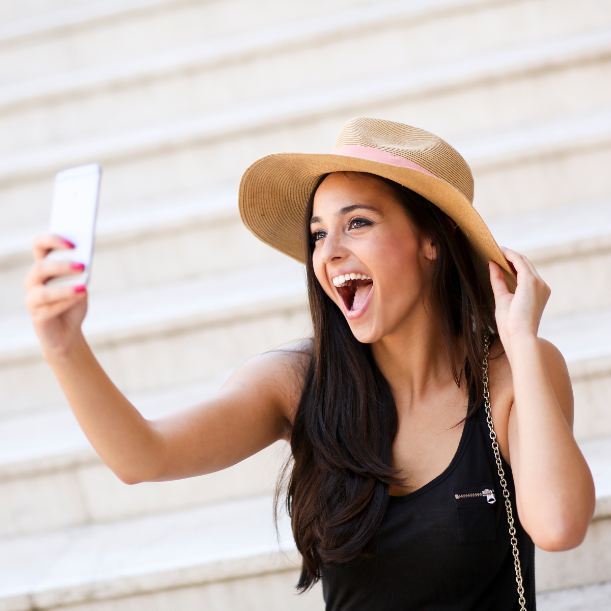 Girl taking selfie -  Featured In: Signs A Girl Likes You Over Text 
