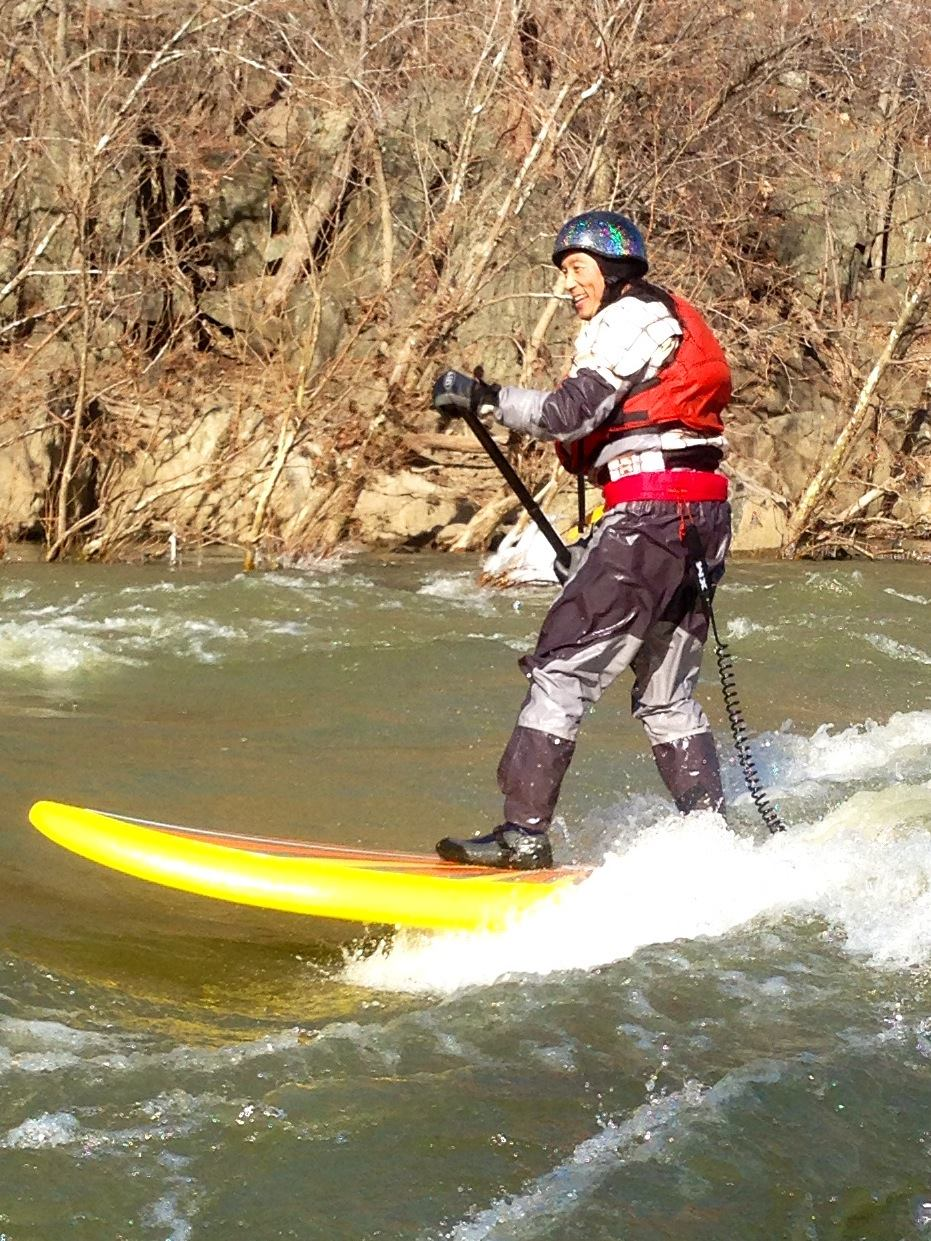 stand up paddle board on a river