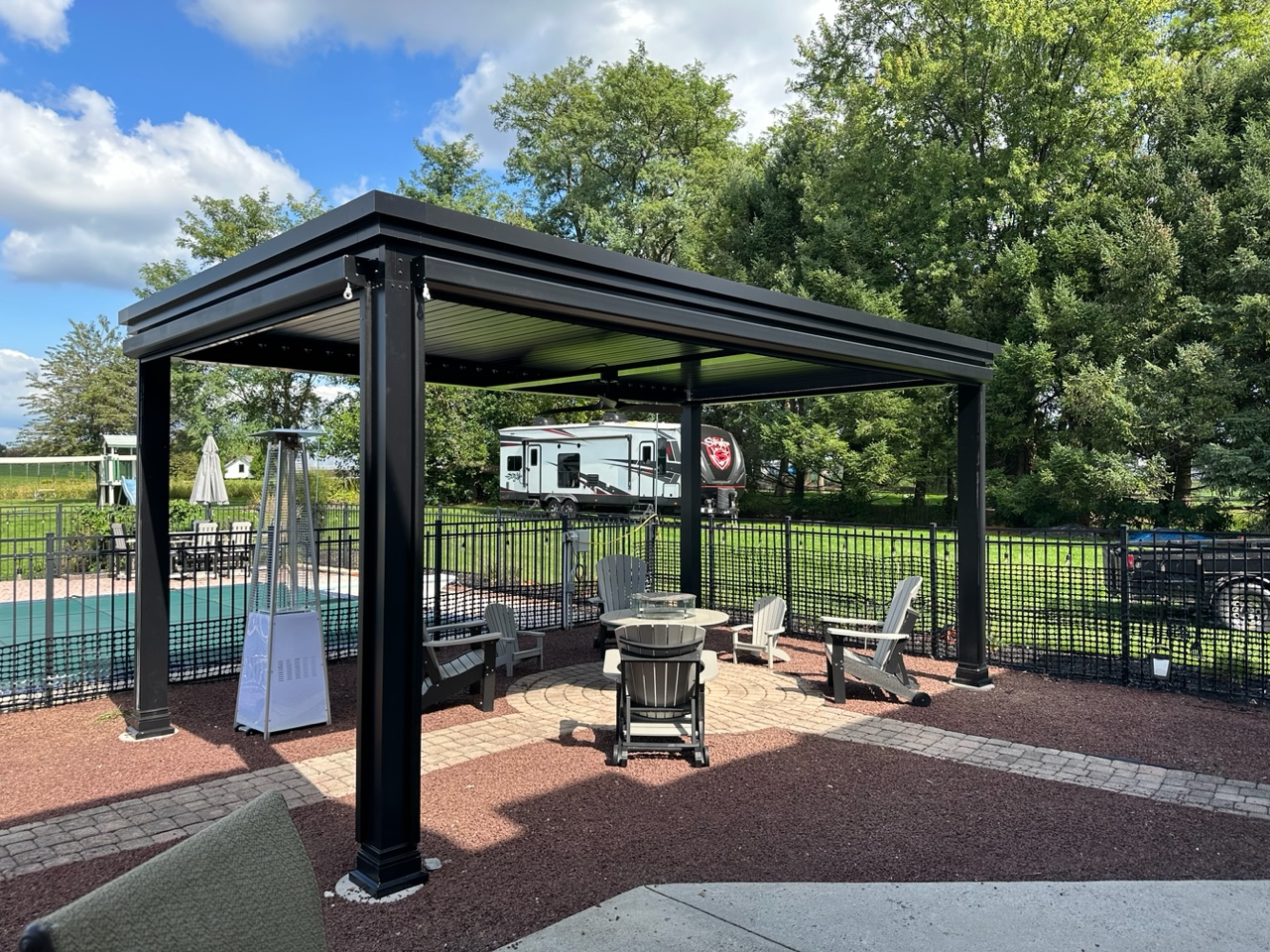 patio space with trees and lounging chairs and furniture behind house