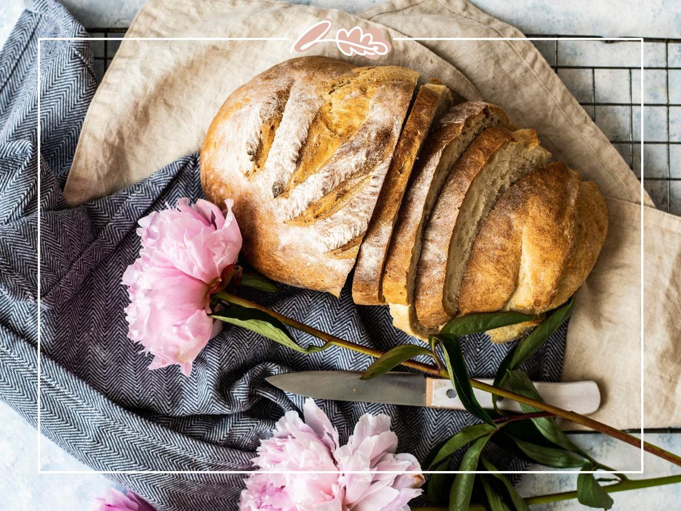 Sliced bread next to pink peonies, a unique combination featured in '11 Fabulous Reasons to Buy Peonies'