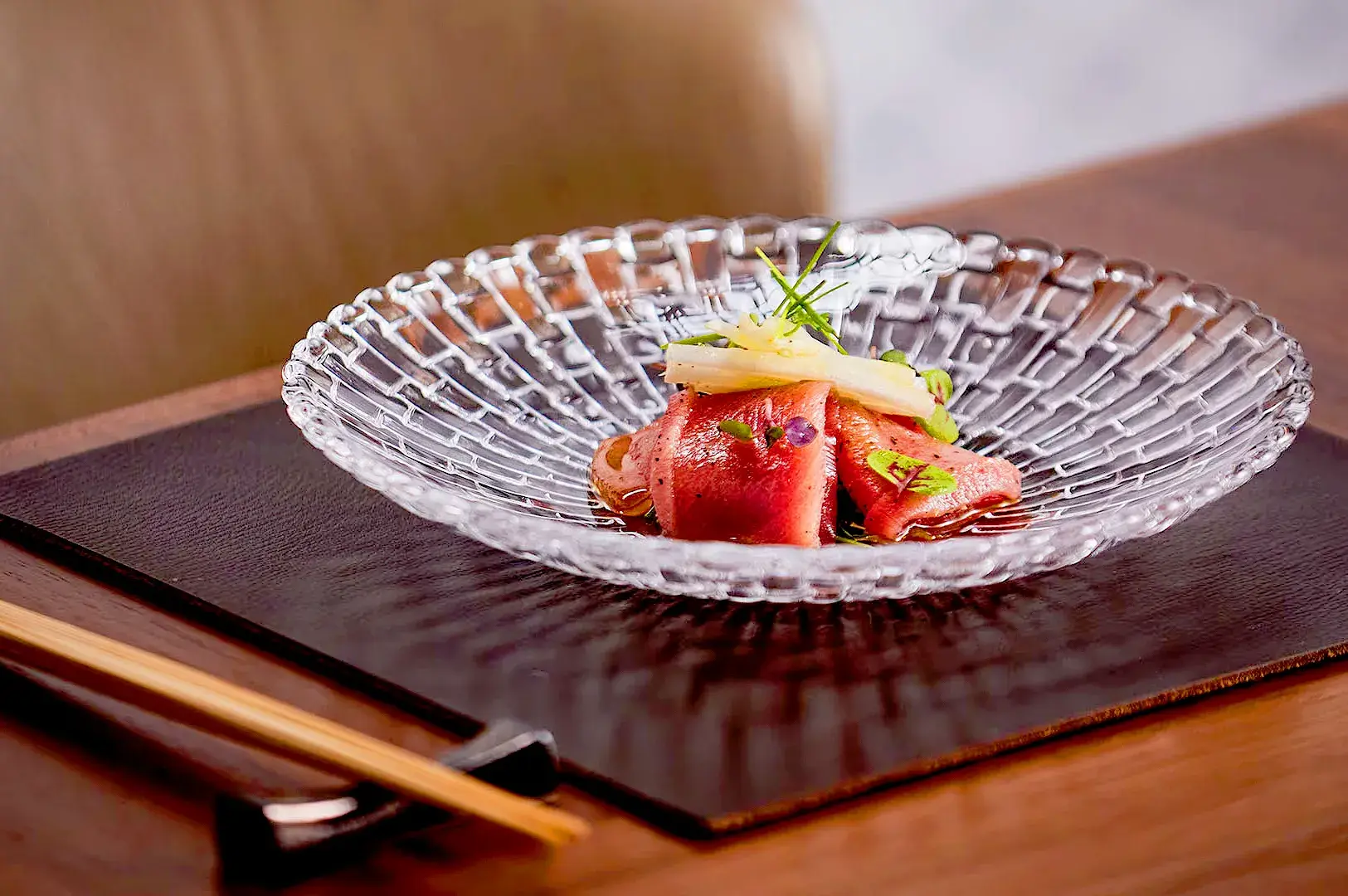 Elegant Waku Ghin Marina Bay Sands Singapore dining room with open kitchen counter, chefs and luxurious Japanese restaurant interior