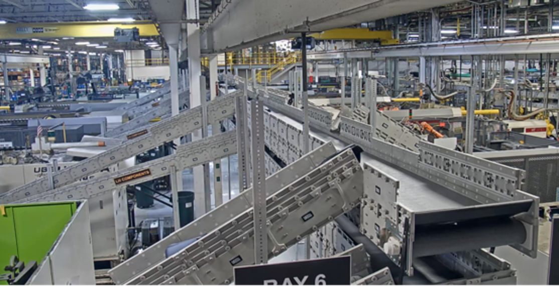 DynaCon incline conveyors in a large warehouse