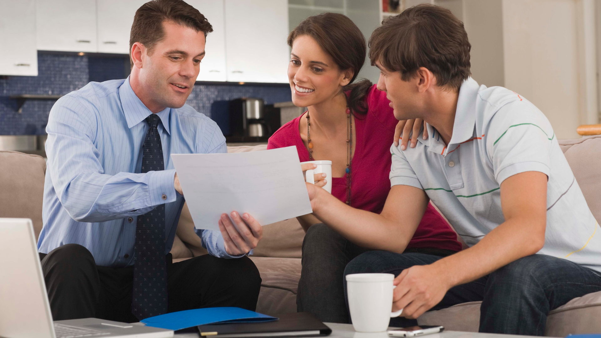 A financial planner helping a couple to create a financial plan for their financial future