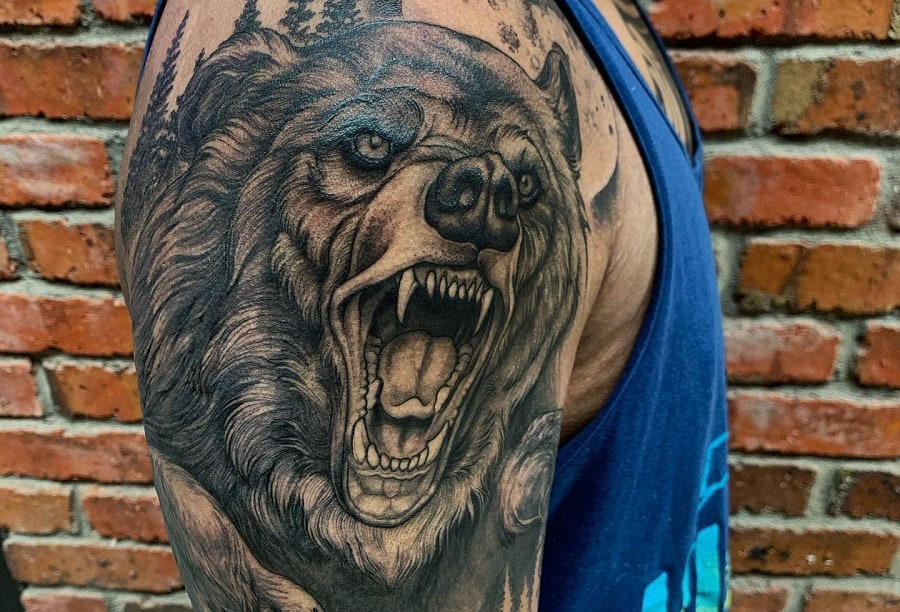 Source: https://nextluxury.com/tattoos/black-bear-tattoo-ideas/    Caption: Bear tattoo on upper arm