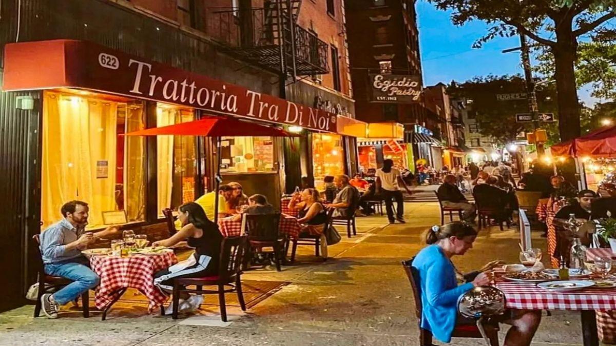 Trattoria Tra Di Noi outdoor dining at dusk in Bronx NY