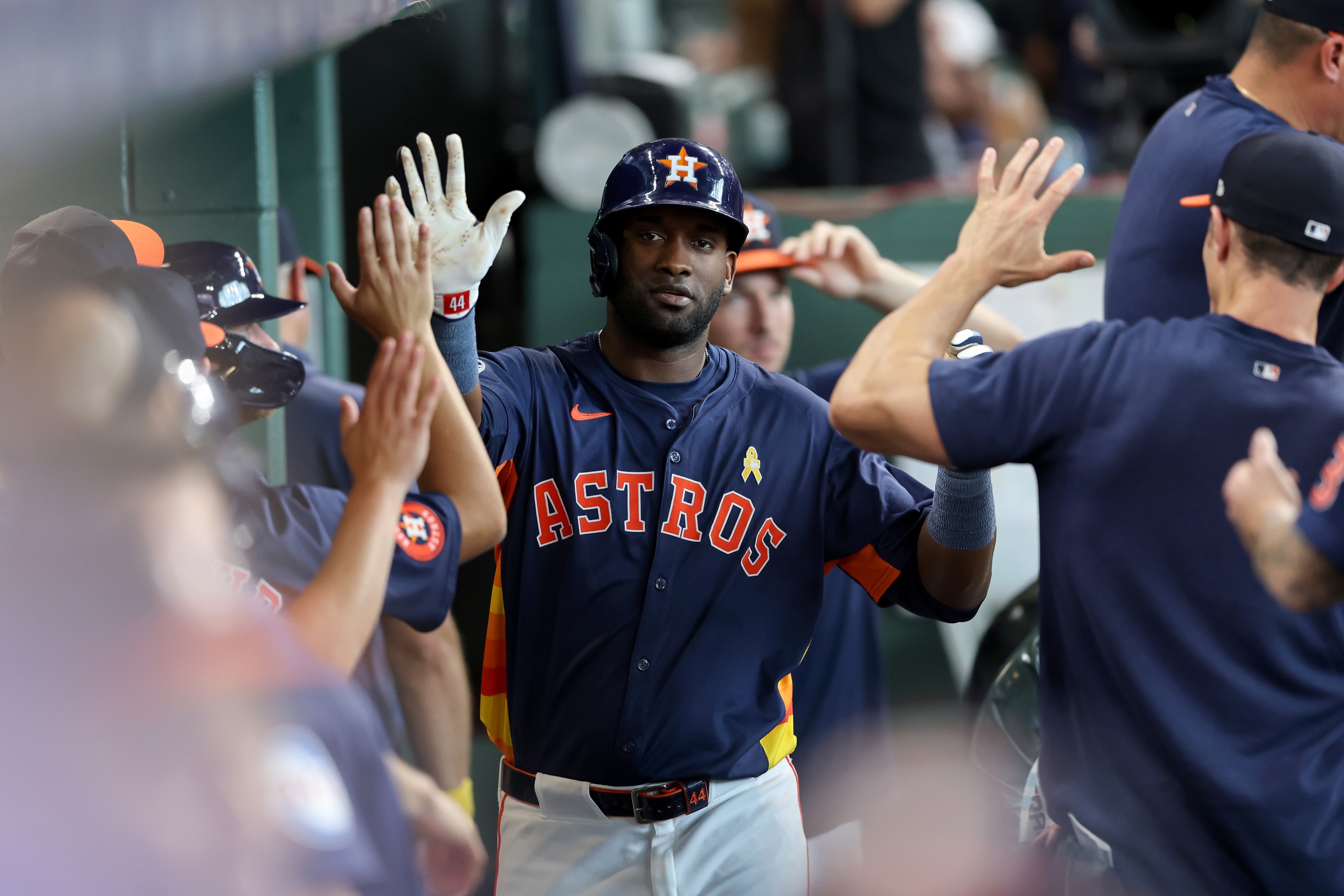 Yordan Alvarez of the Houston Astros is congratulated by teammates in the dugout after a solo home run against the Kansas City Royals in Houston, Texas. 