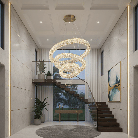 Modern spiral ring chandelier with suspended crystal halos above a staircase in a tall foyer.