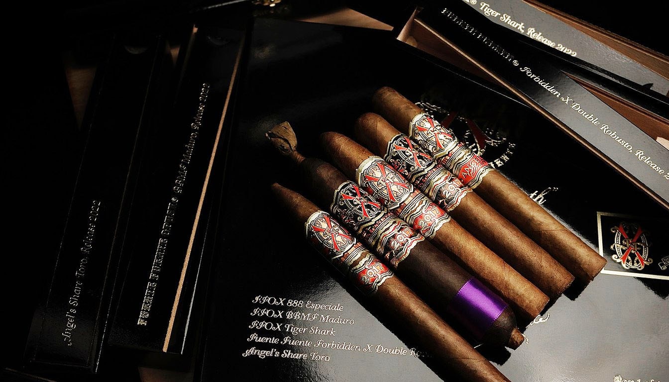 A collection of rare vintage Fuente aged selection cigars on display.