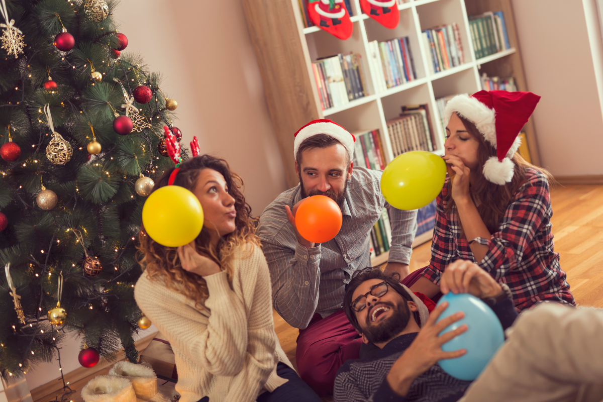 A colorful balloon arch decorated for a holiday party.