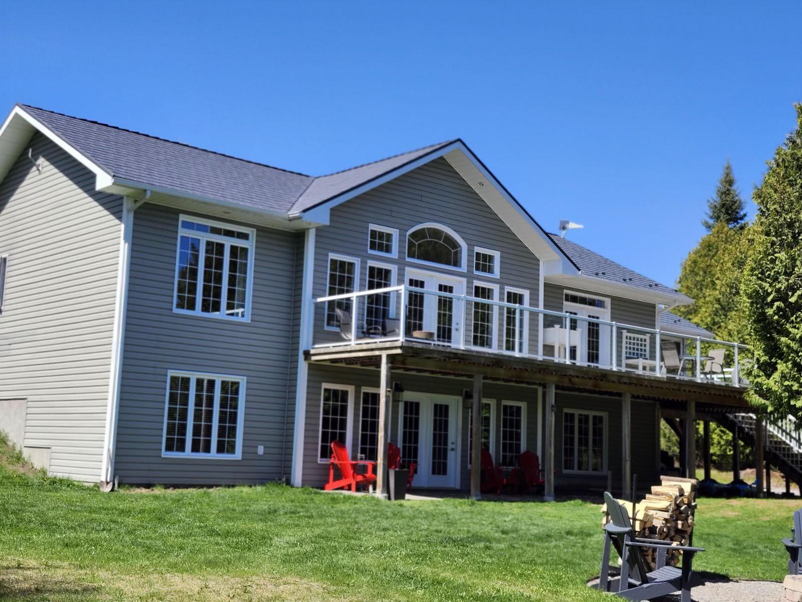 Large Ontario home with new metal roofing system by Roof Pros Plus