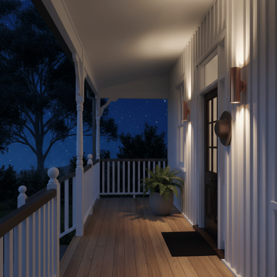 Copper up-down wall lights casting beams on a porch wall.