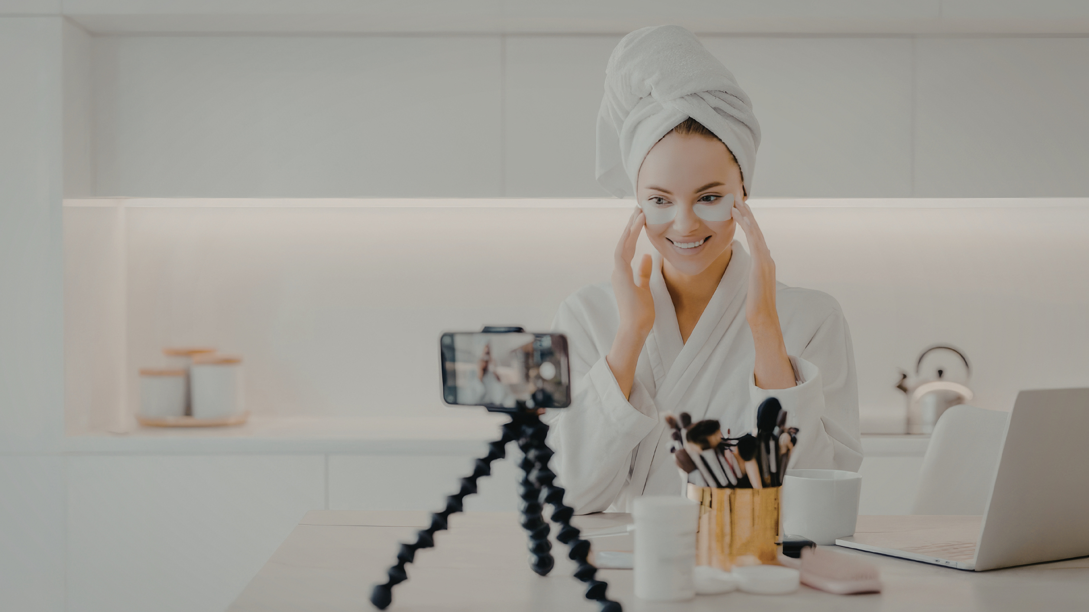 Influencer filming live stream shopping content with skincare products