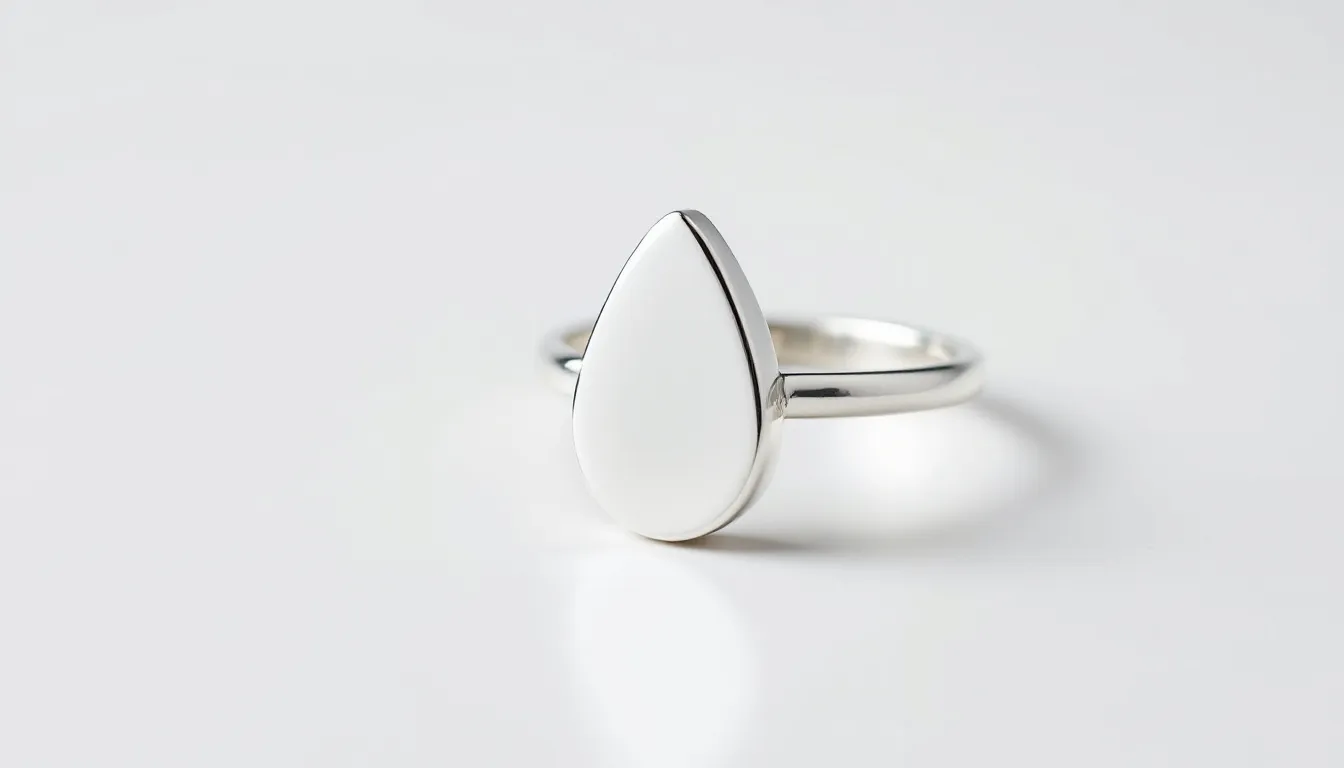 The image features a stunning sterling silver teardrop ring, showcasing a sleek and elegant design that tapers to a point, perfect for adding a touch of sophistication to any jewellery collection. The ring's polished finish highlights its unique shape, making it an ideal gift for friends or a stylish accessory for oneself.
