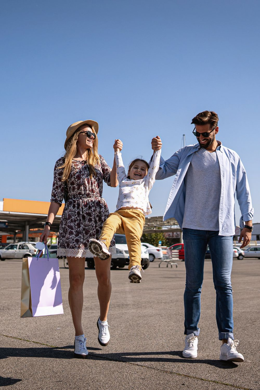 Happy family, mother, father, and child, walking together