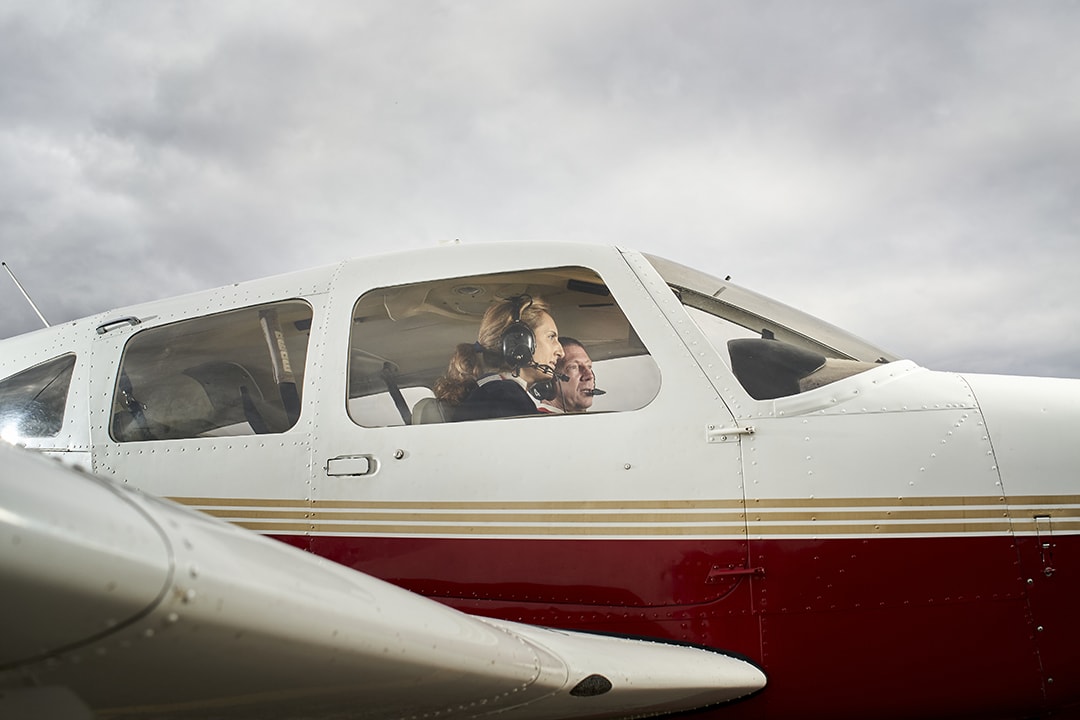 Aspiring pilot speaking with a flight instructor at a Colorado flight school