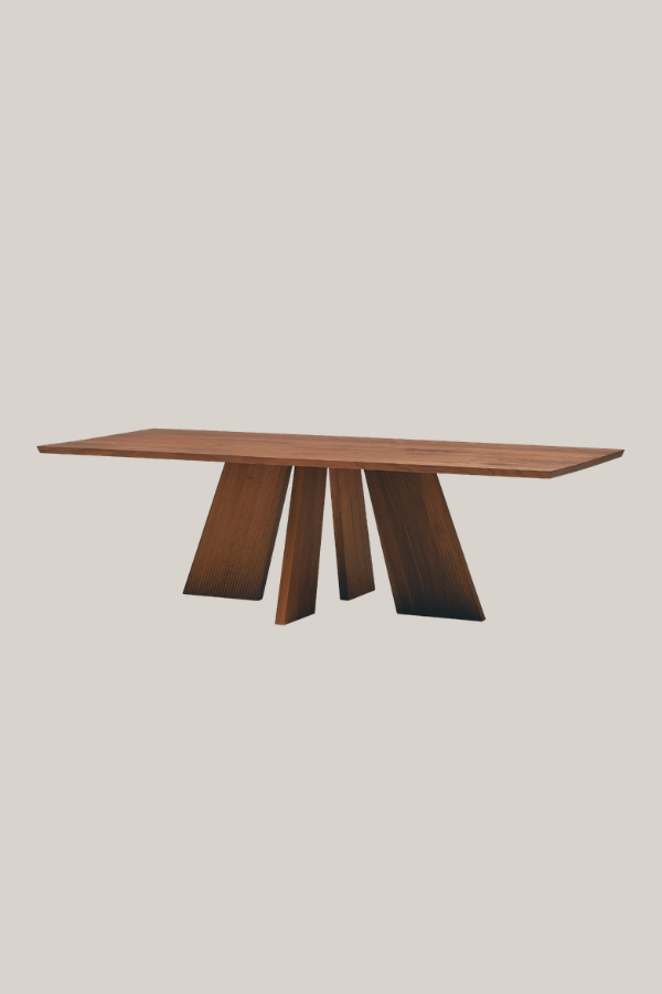 Modern Japanese dining table with a wide rectangular wooden top supported by angled sculptural wooden legs.