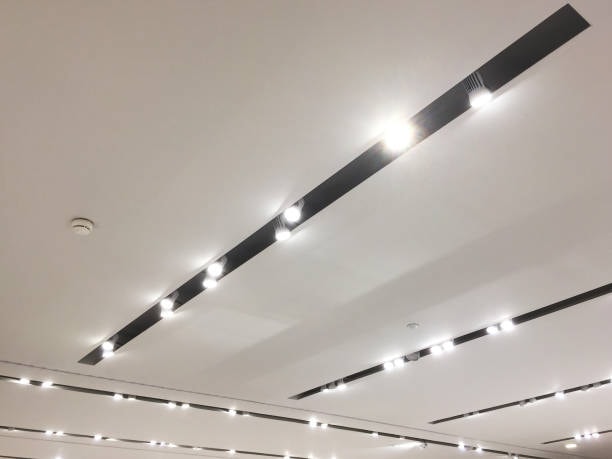 Multiple magnetic track systems installed in a ceiling