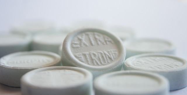 An image of white lozenges for a sore throat.