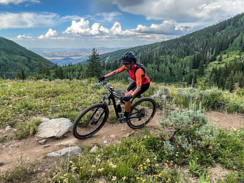 Image of downhill mountain biking on a rugged trail.