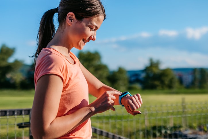 Woman checking her Apple watch 