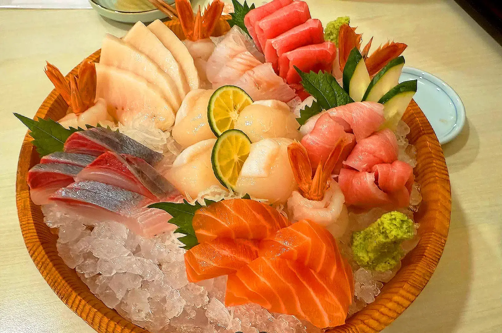 Tomi Sushi Singapore premium sashimi platter featuring salmon, tuna, prawns, scallops and yellowtail