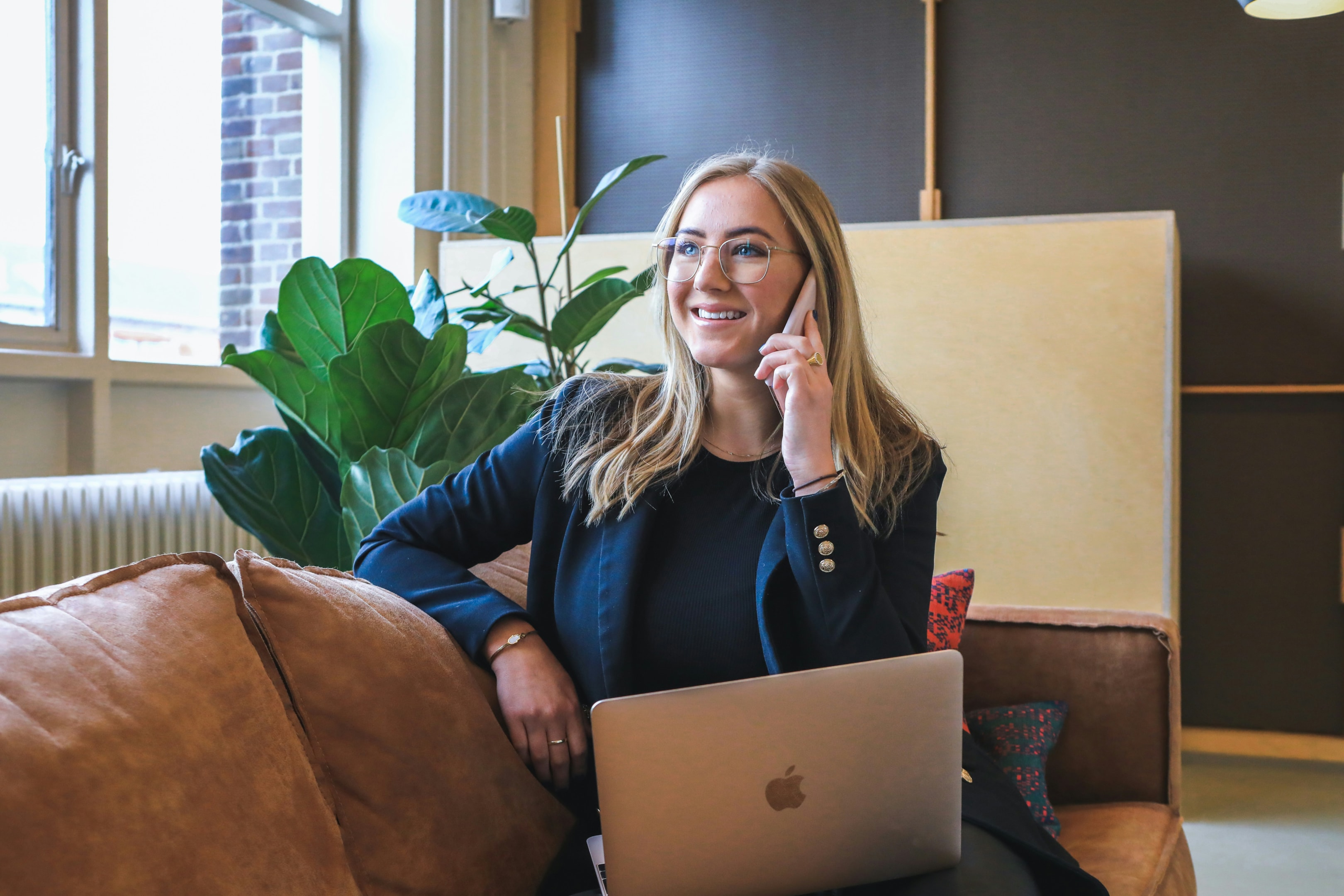 Real estate wholesaler speaks on the phone to a potential lead.