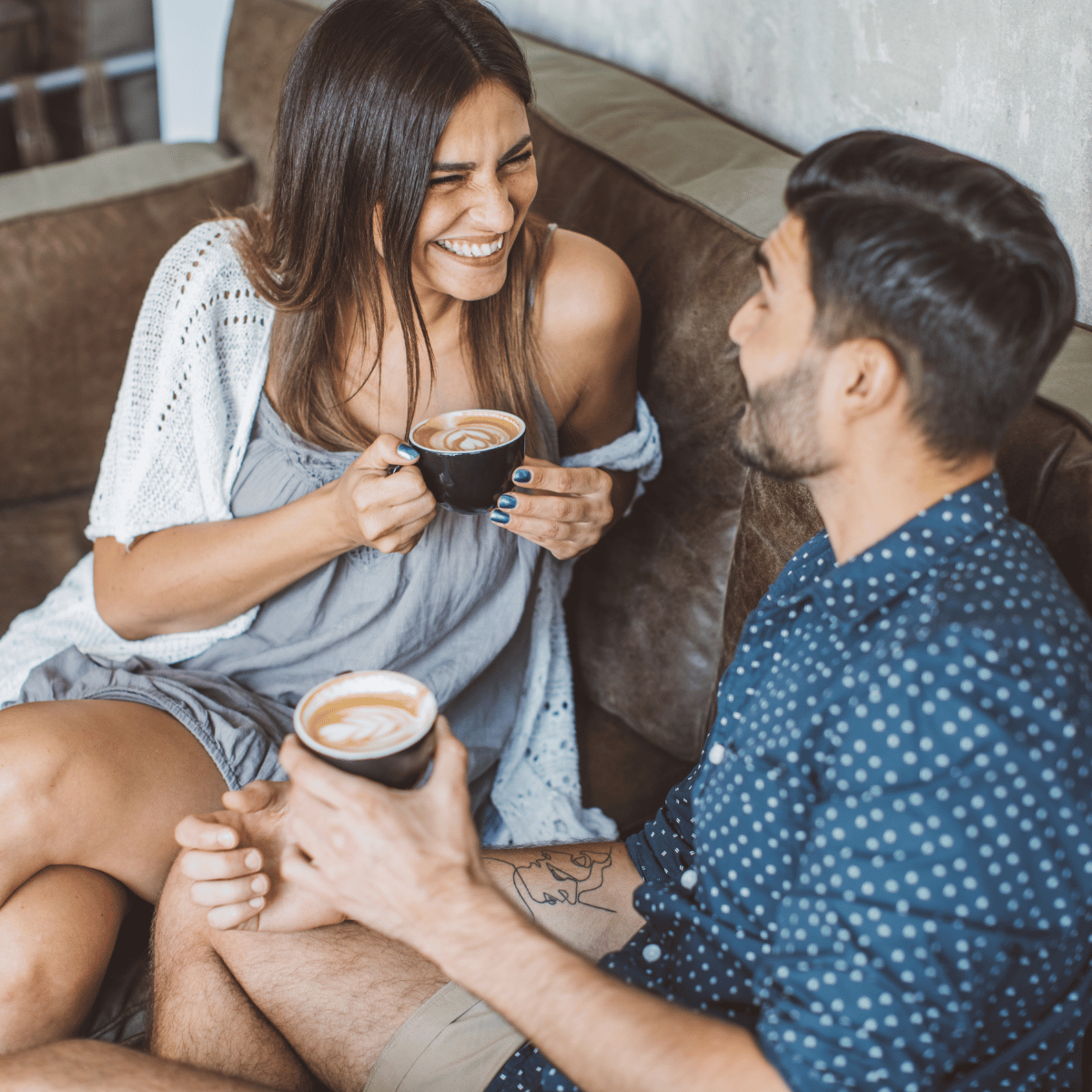 Man and Woman talking over coffee - Featured In : Talking Stages of Dating 