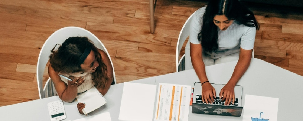 two ladies at desk