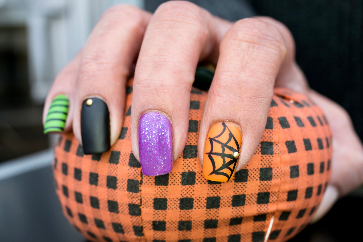 An artistic depiction of spooky spider web nails.