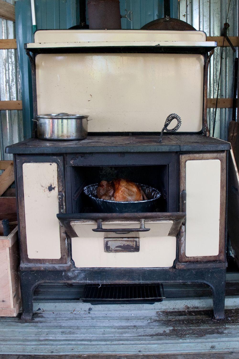 old stove with a turkey cooking in it