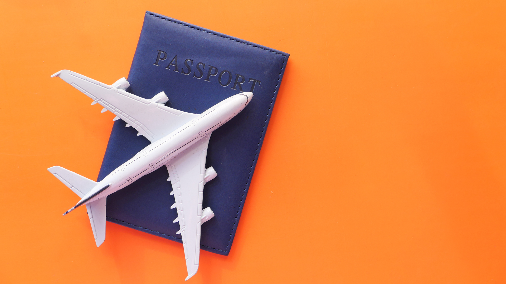 model airplane on top of a passport