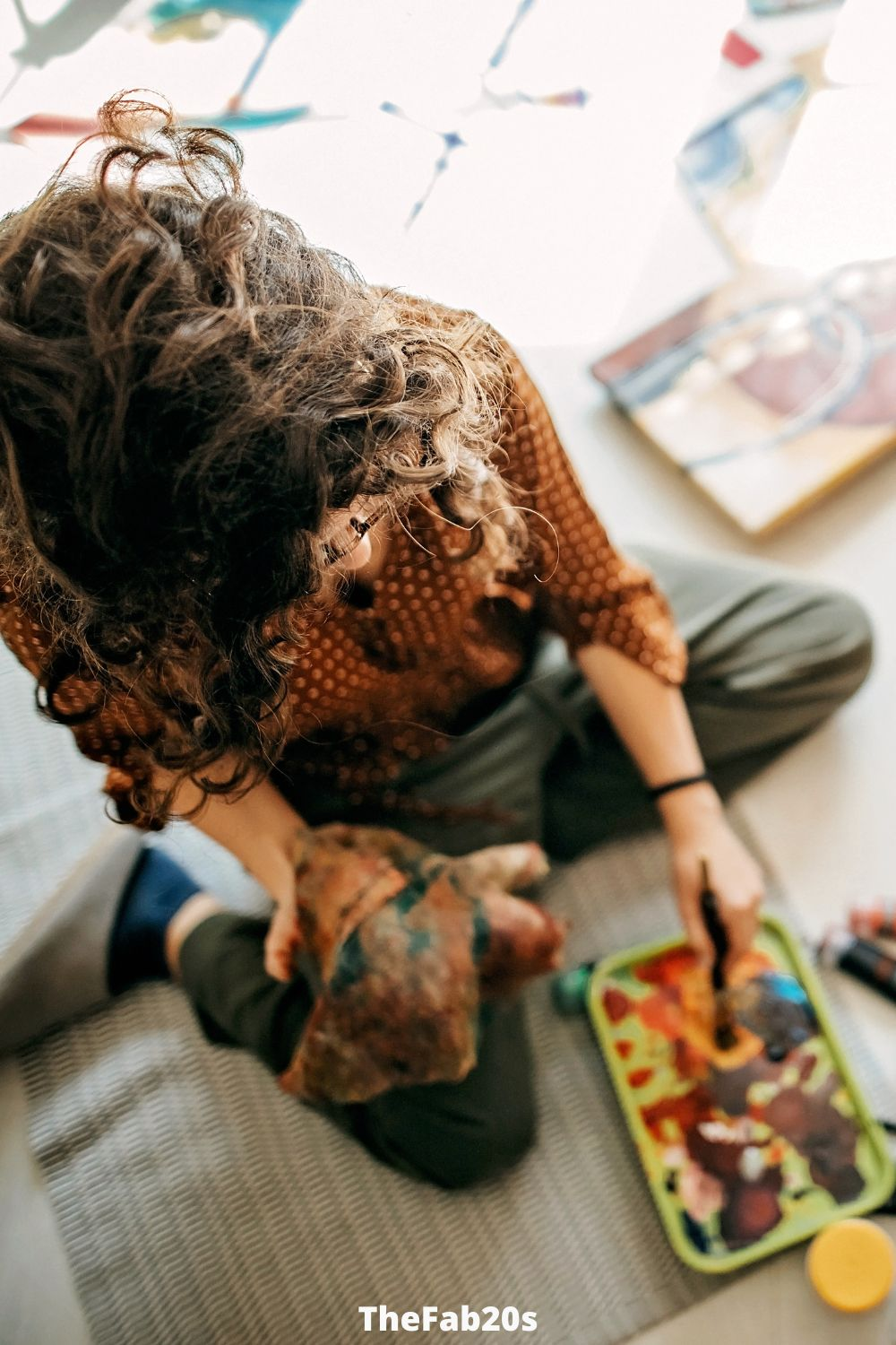 Woman engaging in her hobbies, painting