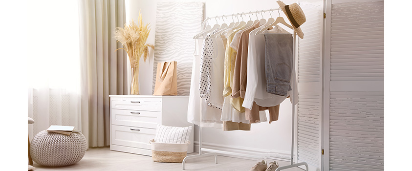 An open clothes rack can make quick work of decluttering your outfits.